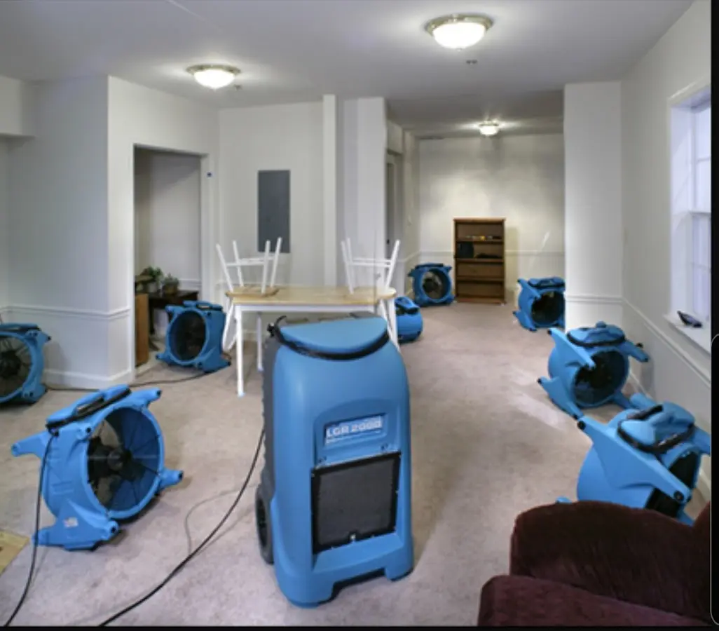 Air movers and dehumidifier setup for Water Damage Restoration in Taunton