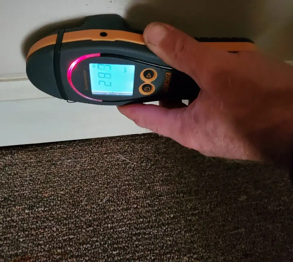 Moisture detection at baseboard during Storm Damage Restoration in Taunton